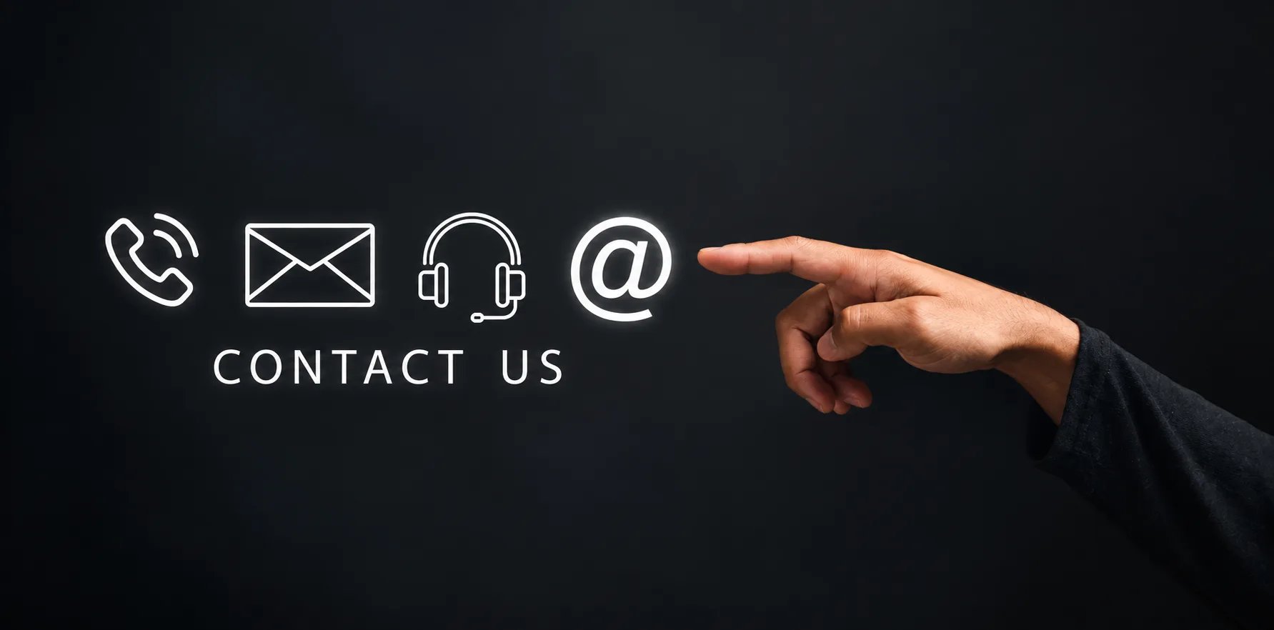 A hand pointing towards glowing phone, mail, support and email icons above the words “Contact Us”.